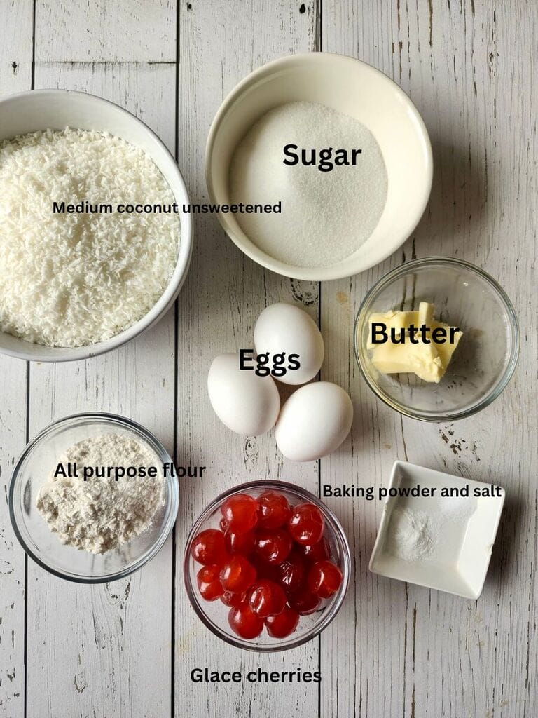 Ingredients include: Medium coconut unsweetened, sugar, eggs, butter, all purpose flour, glace cherries, baking powder and salt.