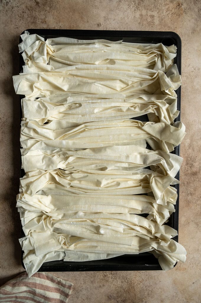 Preparing the phyllo to bake to dry it out.