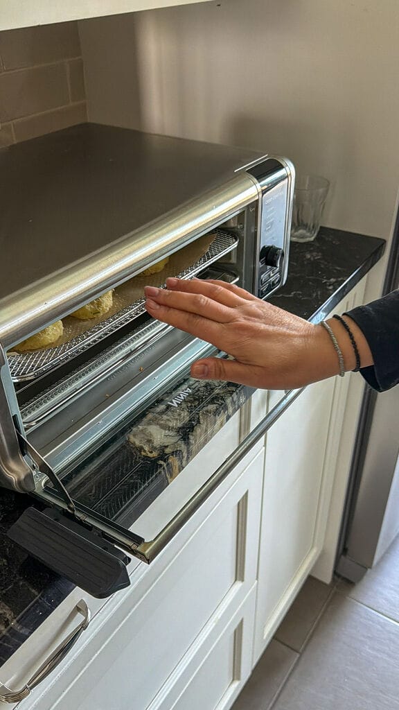 Placing the fritters in the air fryer.
