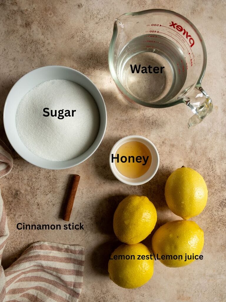 Ingredients for the syrup include: Water, sugar, honey, cinnamon stick, lemon juice and lemon zest
