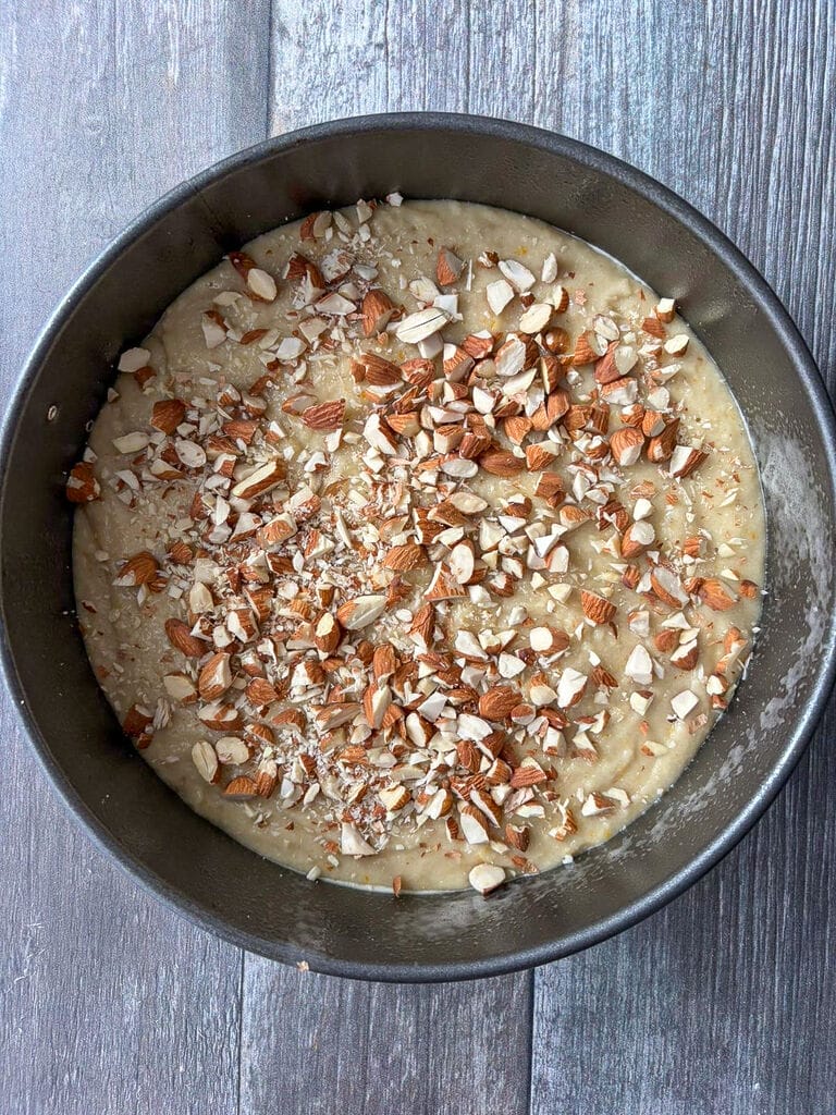 The cake in a springform cake ready to bake.