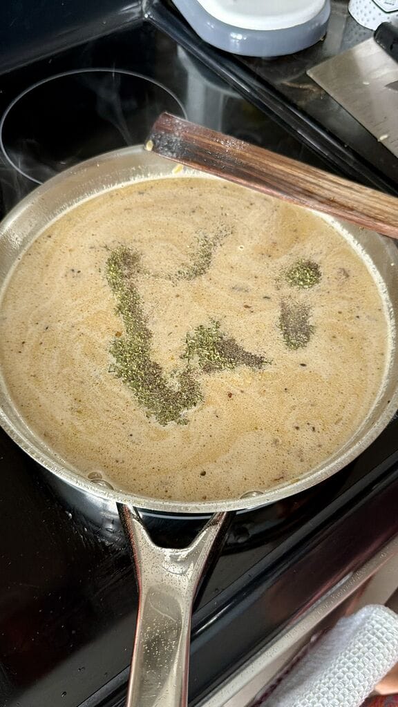 Adding the oregano, salt and pepper to the frying pan.