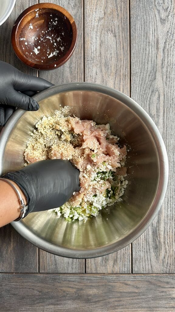 Combining the mixture with your hands.