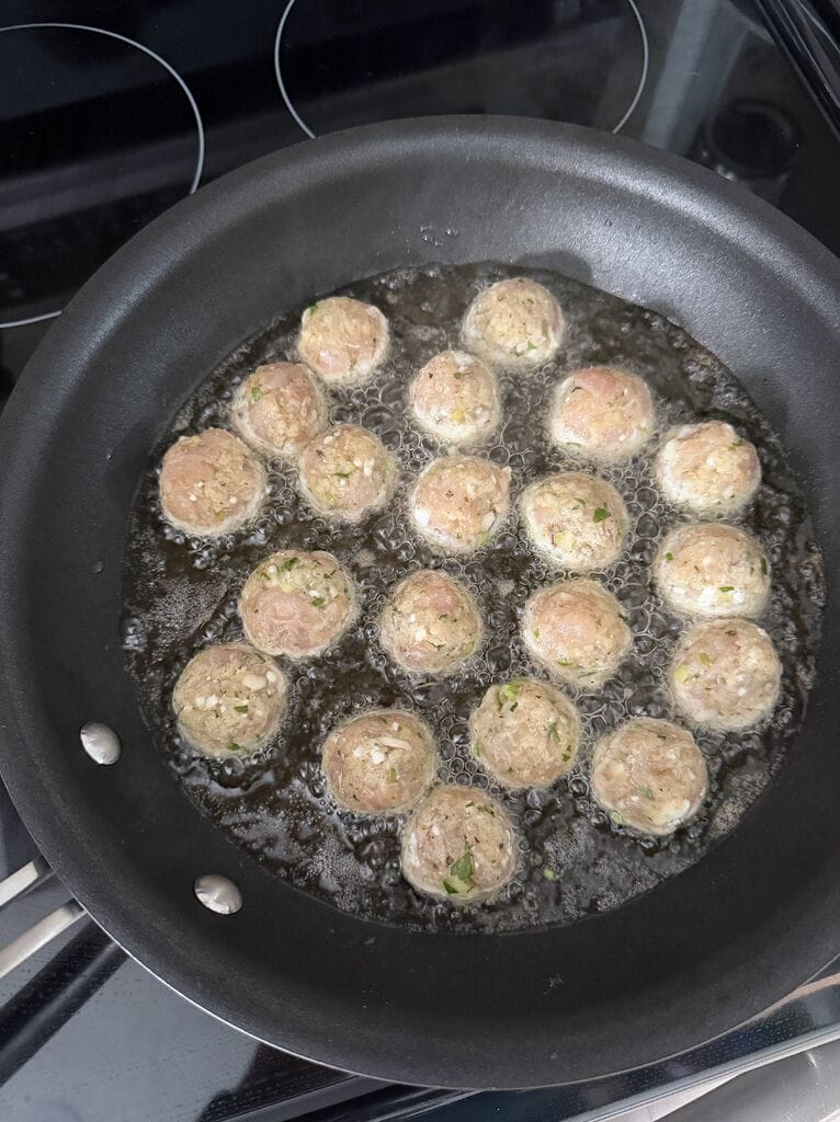 Frying the meatballs.