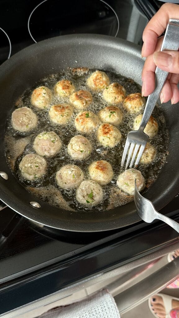 Frying the meatballs.