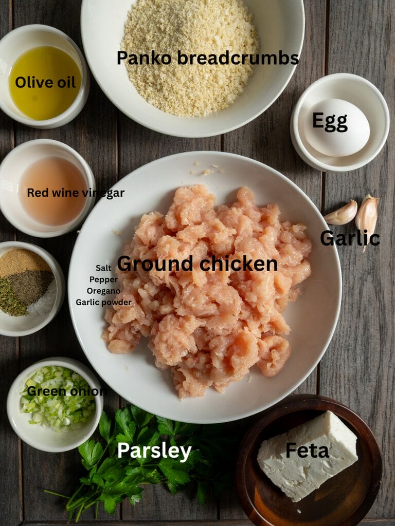Ingredients include ground chicken, panko crumbs, olive oil, red wine vinegar, spices, green onion, parsley, feta, garlic and an egg.