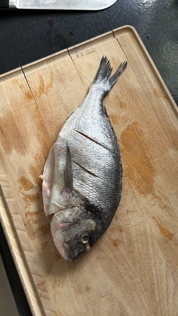 Showing the two cuts per side on the fish.