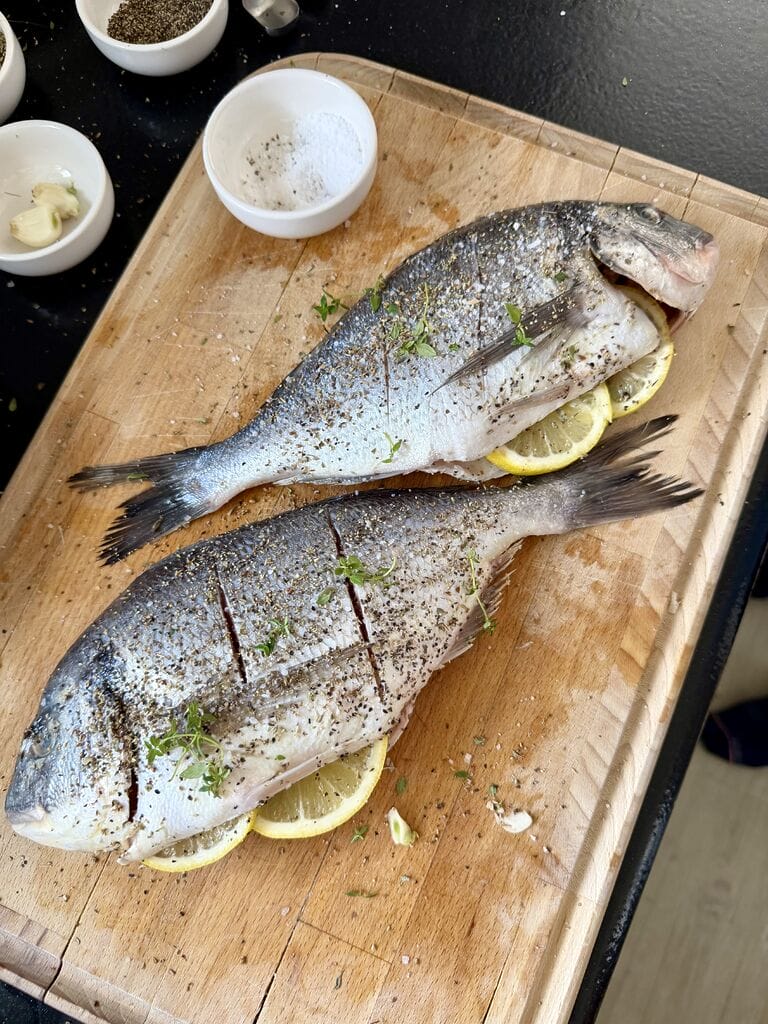 The sea breams have been prepared and are ready to bake.