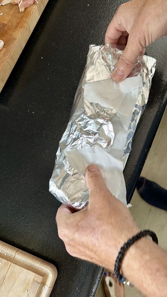 Folding each fish into a little packet.