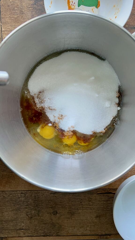 Adding the wet ingredients in mixing bowl.